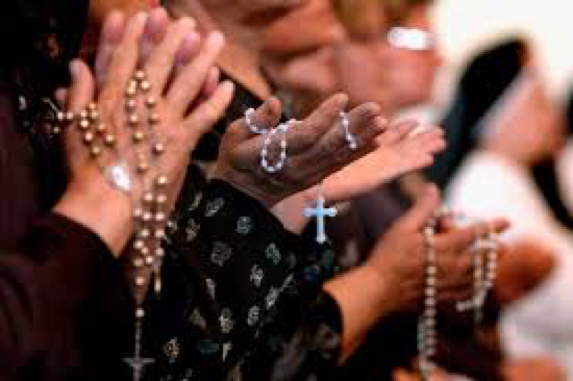 People Praying and Holding Rosaries